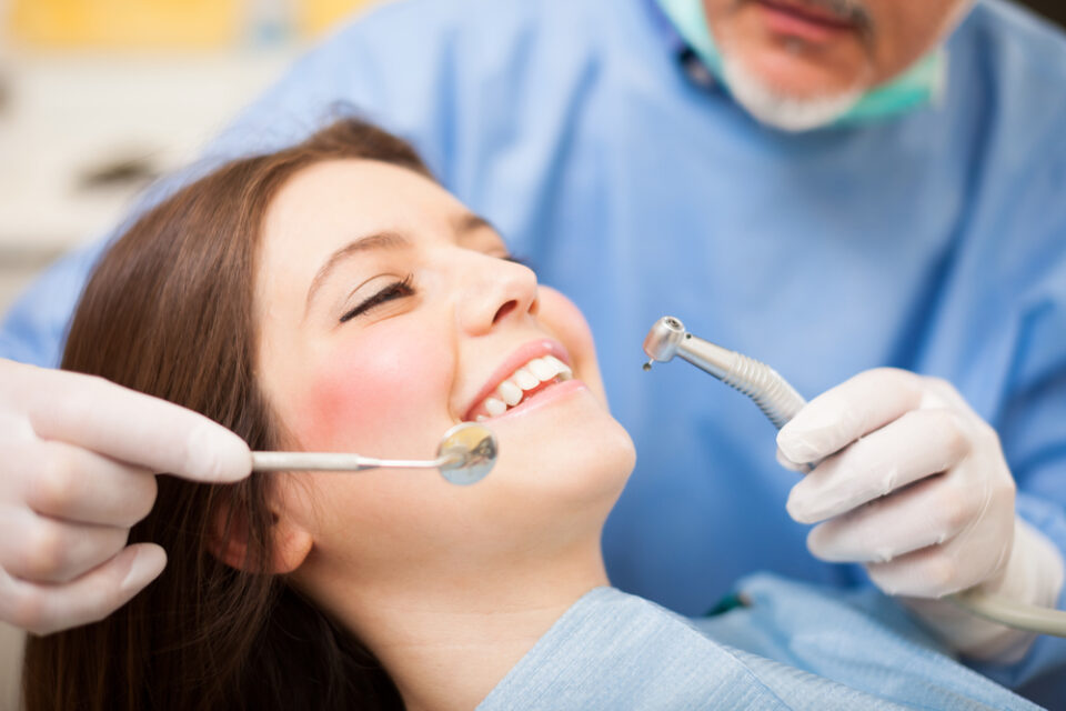 Dentist doing a treatment - dental services | full mouth reconstruction
