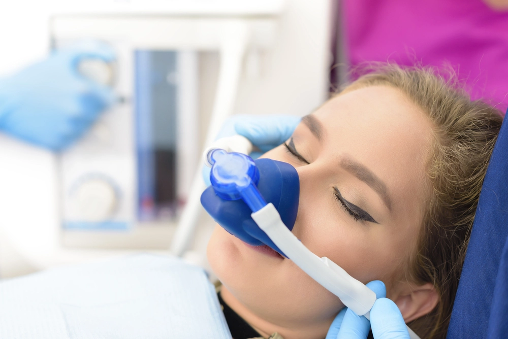 patient sedated in dentist chair | sedation dentistry