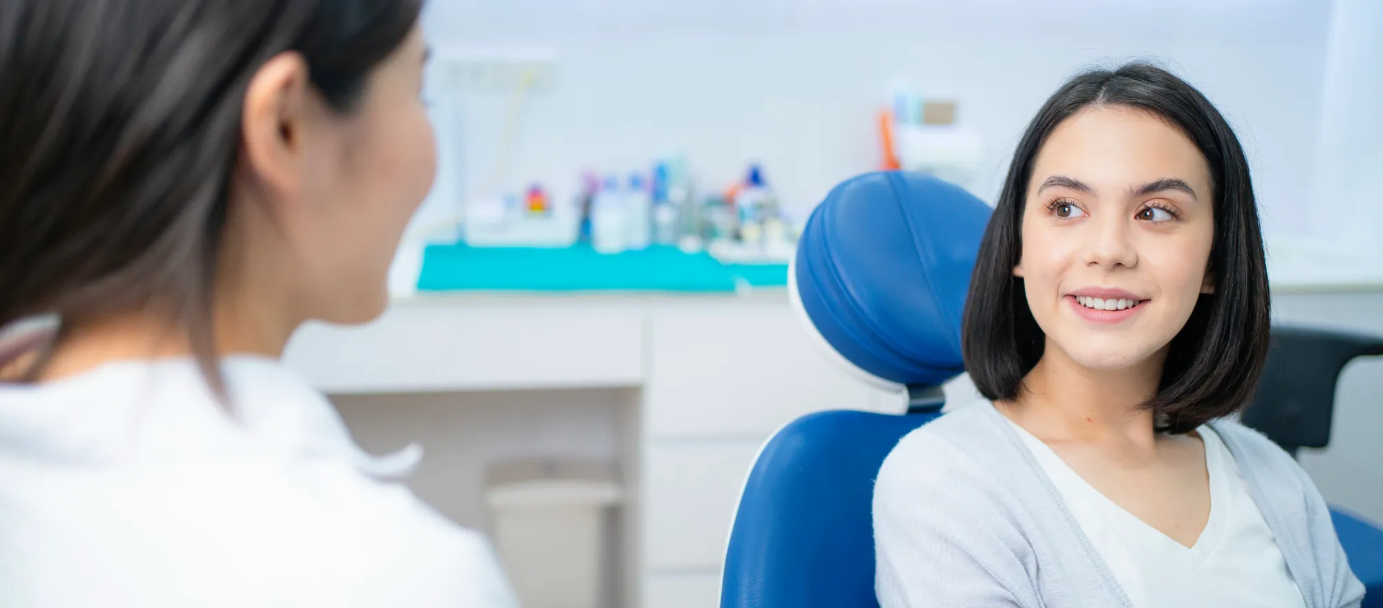 girl talking to a dentist in McKinney TX