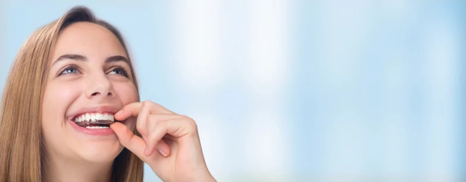 close up of woman with clear teeth aligners in guignard drive