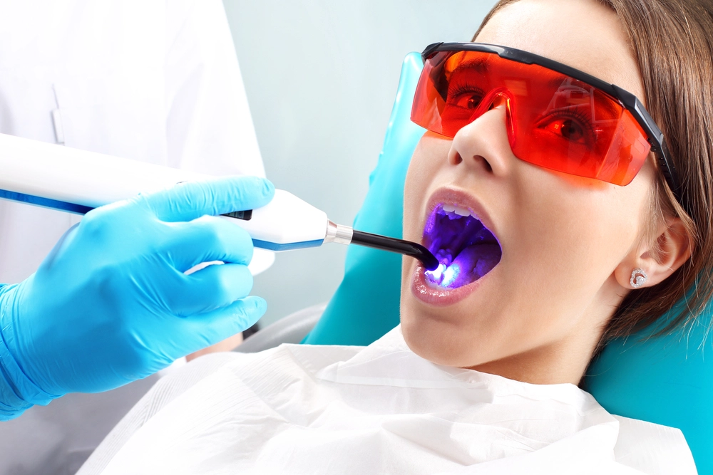 girl undergoing laser dental procedure in dentist in McKinney TX